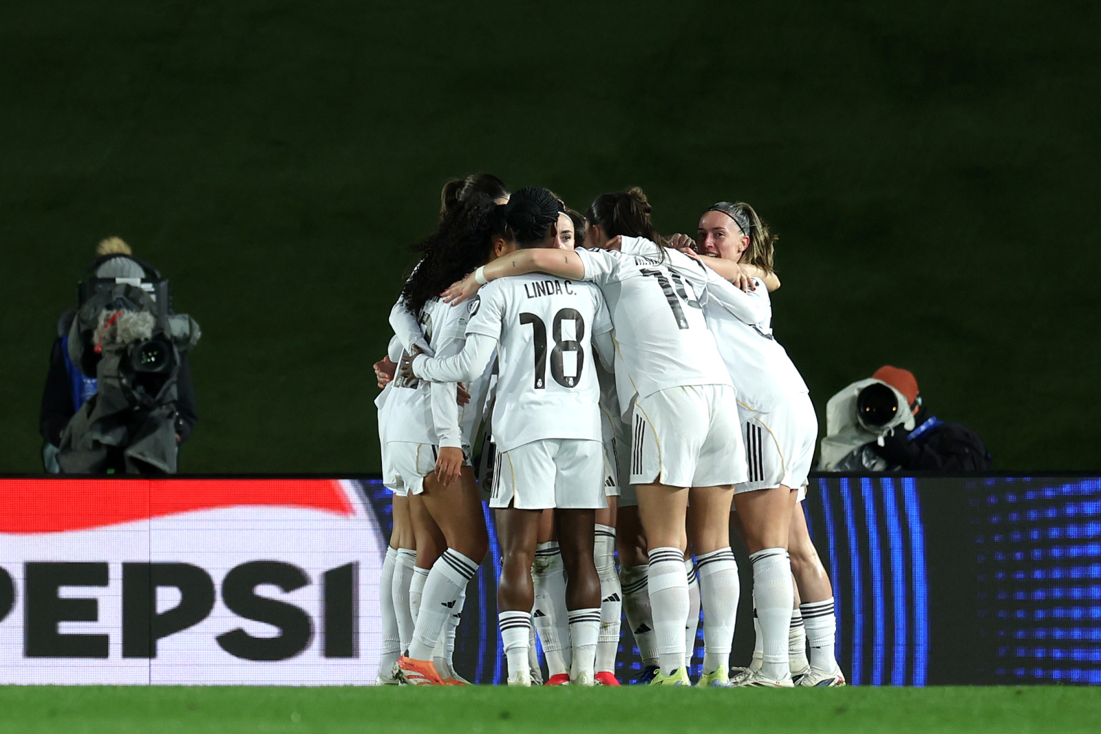 MADRID, SPAIN - FEBRUARY 18: Naomie Feller of Real Madrid (obscured) CF celebrates scoring her team's second goal with teammates during the UEFA Women's Champions League 2025/26 KO play-offs Second Leg match between Real Madrid C.F. and Paris FC at Estadio Alfredo Di Stéfano on February 18, 2026 in Madrid, Spain. (Photo by Judit Cartiel - UEFA/UEFA via Getty Images)