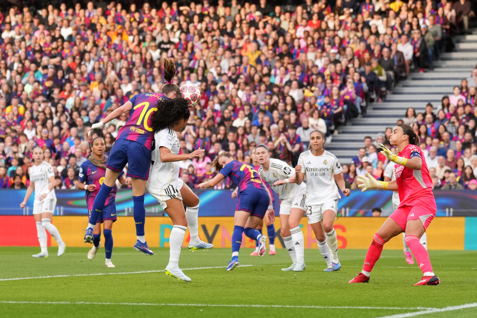 BARCELONA, SPAIN - APRIL 02: Caroline Graham Hansen of FC Barcelona scores her team's second goal while under pressure from Yasmim of Real Madrid CF during the UEFA Women's Champions League 2025/26 Quarter-finals Second Leg match between FC Barcelona and Real Madrid CF at Nou Camp on April 02, 2026 in Barcelona, Spain. (Photo by Alex Caparros - UEFA/UEFA via Getty Images)