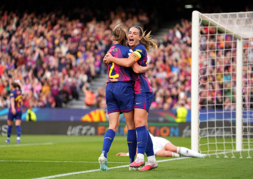 BARCELONA, SPAIN - APRIL 02: Alexia Putellas of FC Barcelona congratulates tam mate Irene Paredes after she scores her team's third goal during the UEFA Women's Champions League 2025/26 Quarter-finals Second Leg match between FC Barcelona and Real Madrid CF at Nou Camp on April 02, 2026 in Barcelona, Spain. (Photo by Alex Caparros - UEFA/UEFA via Getty Images)
