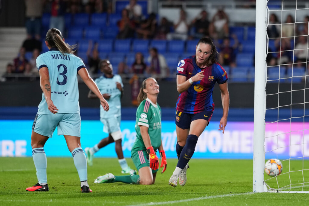 BARCELONA, SPAIN - SEPTEMBER 23: Mylene Chavas of Paris FC reacts as Ewa Pajor of FC Barcelona celebrates scoring her teams third goal during the UEFA Women's Champions League 2026/27 League Phase MD1 match between FC Barcelona and Paris FC at Estadi Johan Cruyff on September 23, 2026 in Barcelona, Spain. (Photo by Alex Caparros - UEFA/UEFA via Getty Images)