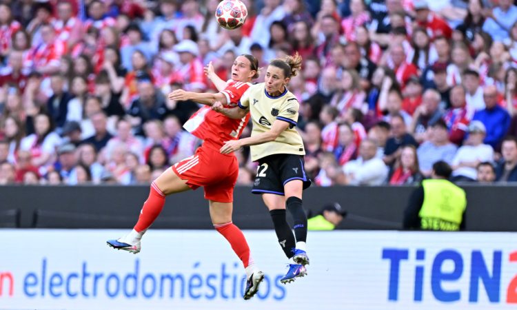 MUNICH, GERMANY - APRIL 25: Klara Buhl of FC Bayern Munchen and Ona Batlle of FC Barcelona battle for possession of the ball in the air during the UEFA Women's Champions League 2025/26 Semi-Final First Leg match between FC Bayern München and FC Barcelona at Munich Football Arena on April 25, 2026 in Munich, Germany. (Photo by Sebastian Widmann - UEFA/UEFA via Getty Images)